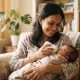 Mother feeding newborn baby with a wide-neck nursing bottle