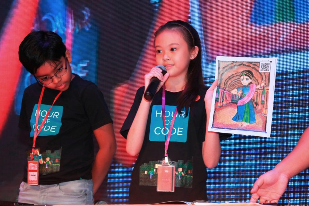 KidZania CongreZZ member Alysha Chin Jia Qi, 11, from SK Taman Megah demonstrating about Augmented Reality at the KidZ & Tech launch recently using a picture she coloured herself