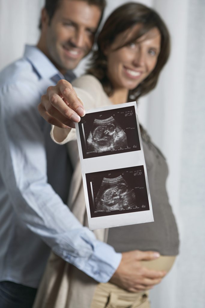 Expecting Couple with Sonogram